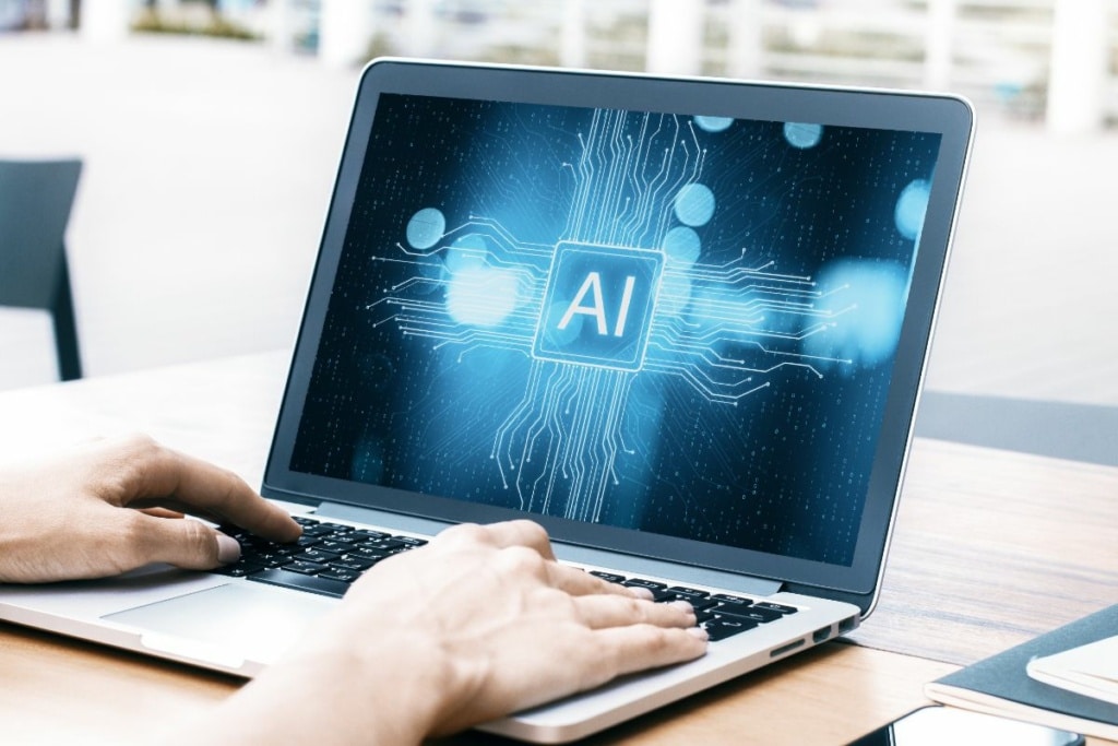 Écran d'ordinateur affichant "AI"